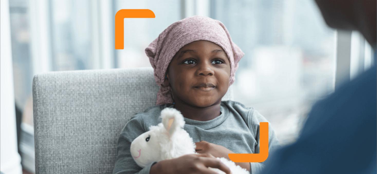 Child holding a fluffy toy framed by the arm device created as part of the Children with Cancer UK charity branding
