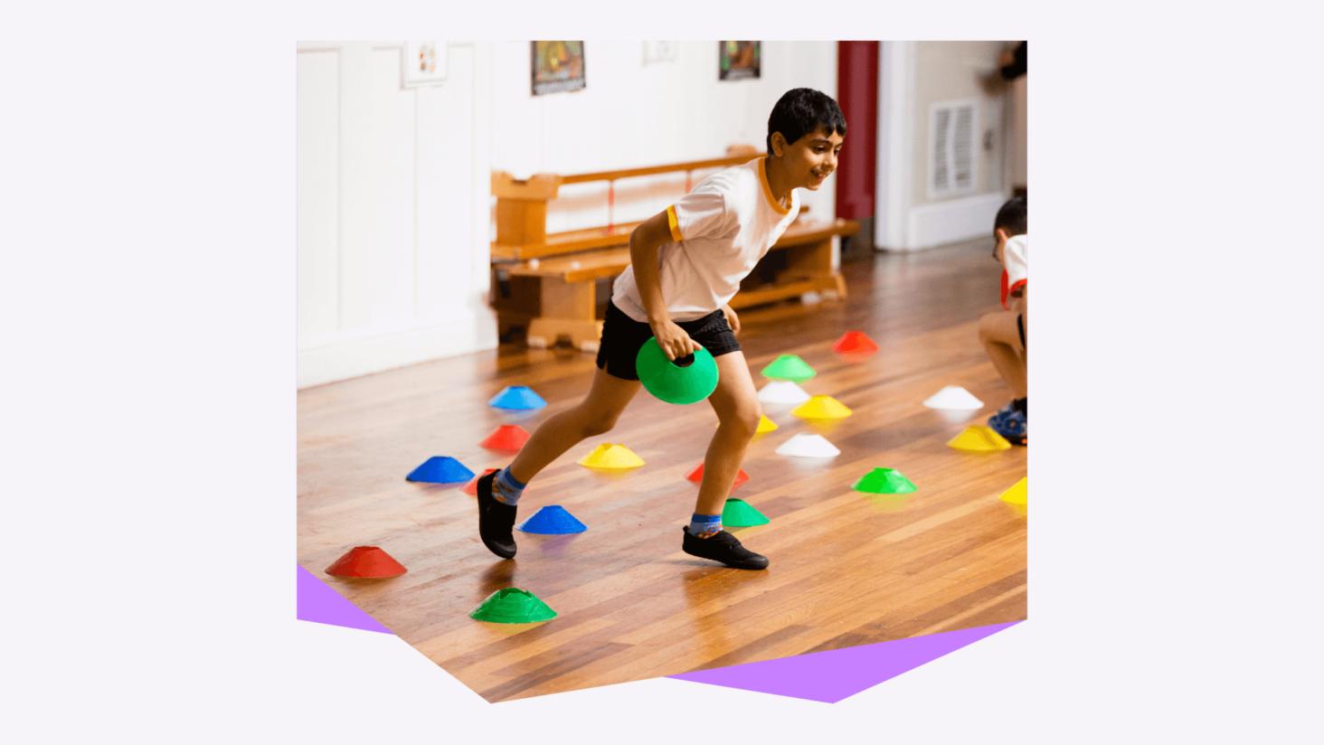 Image for A student playing a game in a sport hall, held within a graphical device created as part of the brand refresh